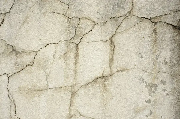 Klasik Çatlak Detay: yıpranmış, hasarlı alçı. Antika veya grunge projeleri için pürüzlü, dokulu arka plan.