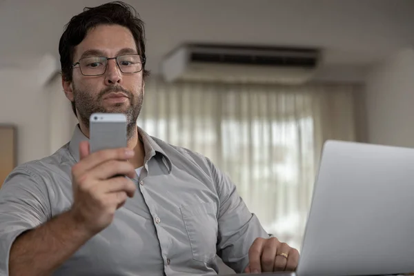 Brazilian Man Distracted His Cell Phone While Working Home Doing — Zdjęcie stockowe