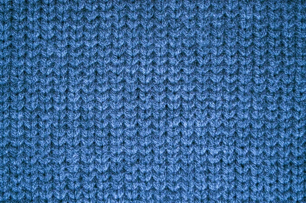 ニット ブランケットだ ヴィンテージ織の織物 ニットウェアXmas背景 クローズアップニットセーター 青い柔らかい糸 北欧の冬の糸 繊維布刺繍 編組ニットブランケット — ストック写真