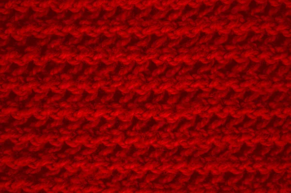 構造ニット生地 ヴィンテージ織パターン 織ニット暖かい背景を着用してください ニットウール 赤いマクロスレッド 北欧の冬の毛布 リネンキャンバスの衣服 クローズアップ概要ウール — ストック写真