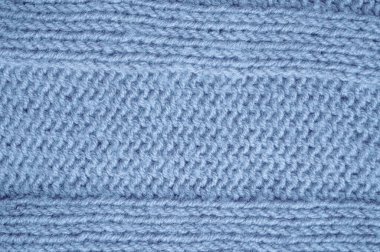 Yapı örgüsü süveter. Soyut yün dokusu. El yapımı Xmas Arka planı. Örgü battaniye. Mavi Macro İplik. İskandinav Kış Ekoseli. Fiber Jumper Kaşmir. Ayrıntılı Örgü Süveter.