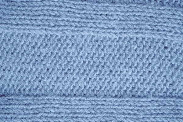 構造ニットセーター 概要ウール素材 手作りのクリスマスの背景 ニット ブランケットだ 青いマクロスレッド 北欧の冬の遊び 繊維ジャンパーカシミア 詳細ニットセーター — ストック写真