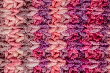 Makro örgü kumaş. Klasik kumaş kumaşı. Örgü Noel arkaplanı. Yapı Soyut Yün. Kırmızı pamuk ipliği. İskandinav sıcak tuvali. Halı kaşmir dokuma. Örgü Yün.