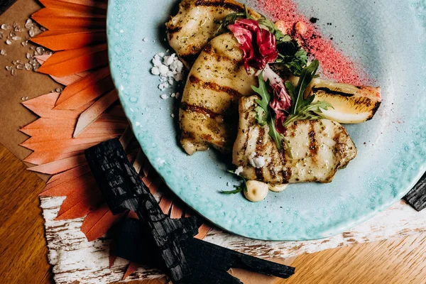 stock image Grilled squid with lettuce leaves and lemon