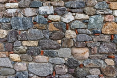 Stone masonry wall as an abstract background.