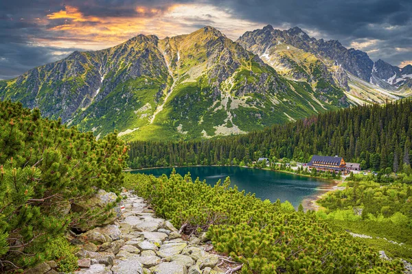 stock image Picturesque panoramic view of Popradske Pleso, Tatra mountains, Slovakia. Lake Popradske pleso with mountain hotel in High Tatras.