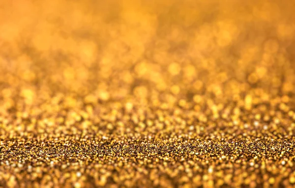 光沢のある金色の輝きのテクスチャの背景クローズアップ — ストック写真