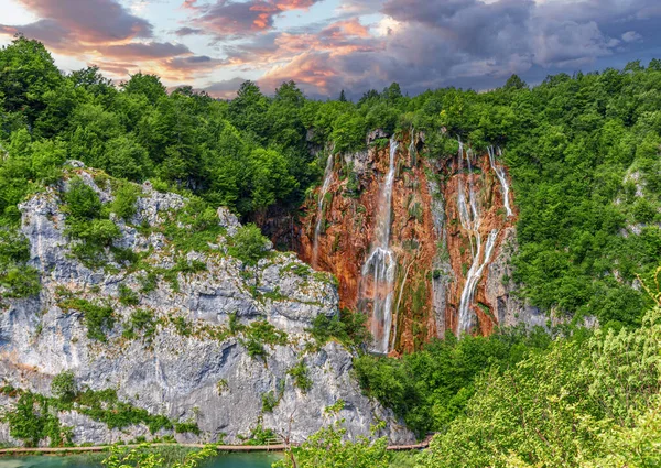 Picturesque waterfall. Waterfall among rocks and forest. Plitvice Lakes, Croatia.