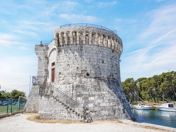 Castle tower against the blue sky. Medieval castle tower. Trogir. Croatia.