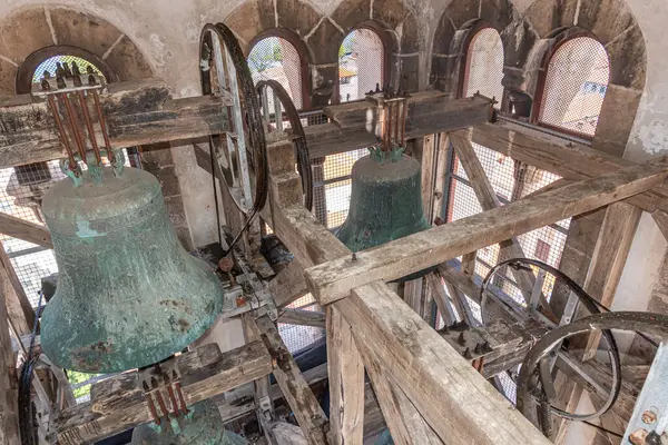 Old bells in the bell tower on the tower.