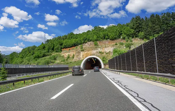 Tunnel on a highway. A tunnel in a mountain on a country highway.