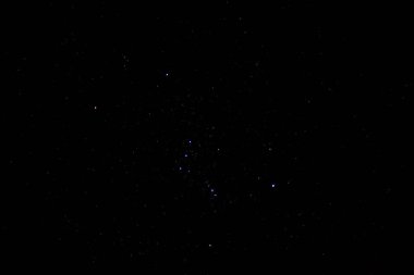 The actual constellation Orion in the night sky. The constellation Orion consists of the famous supermassive stars Betelgeuse, Rigel, and Bellatrix. clipart