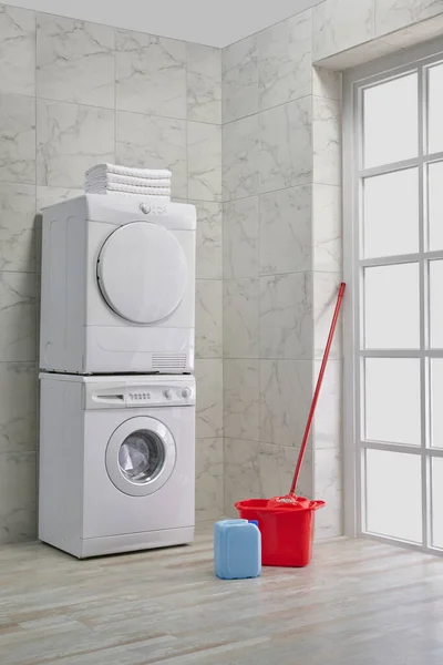 Washing and dryer machine in a row, cleaning kits, decorative bath room style, corner concept.