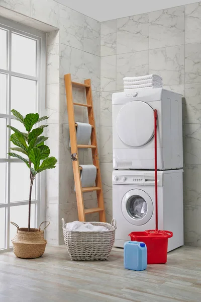 Washing and dryer machine in a row, cleaning kits, decorative bath room style, corner concept.