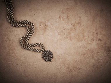 Elegant jewelry set ring, necklace and earrings with diamonds.Product still life concept. Modern and decorative textured background.