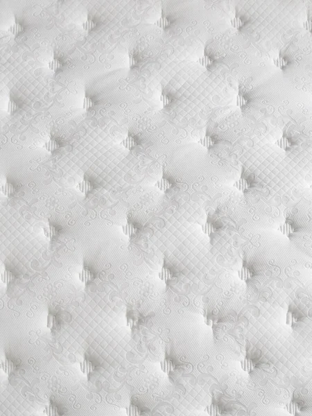 Bed surface close up style, quilted face, white.