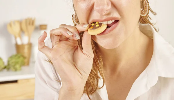 Woman Eating Biscuit Close Mouth Hand Kitchen Background Style — Stock Photo, Image