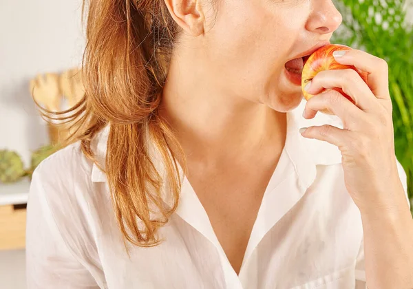 Woman Eating Apple Close Mouth Hand Kitchen Background Style — Stock Photo, Image