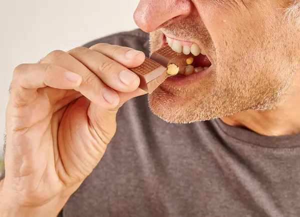 Man Eating Chocolate Close Hand Mouth Kitchen Background Stock Picture