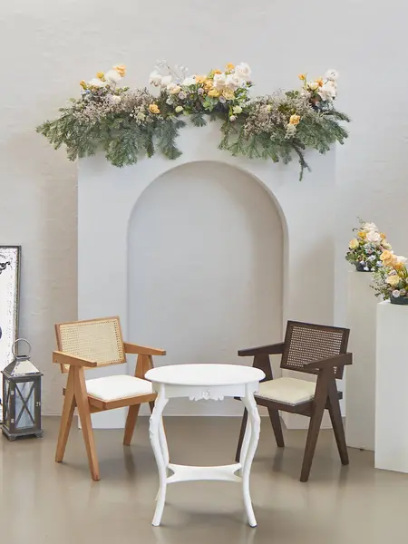 Engagement organization decoration interior style, chair table room and modern flowers detail.