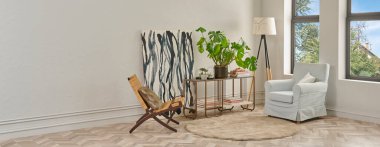 Bu dingin oturma odasında minimalist bir tasarım var. Ringa sandalyesi, yuvarlak halı, konsol masası ve soyut sanat eserleri var. Hepsi klasik beyaz duvarlara ve ringa kemiği zeminine karşı..
