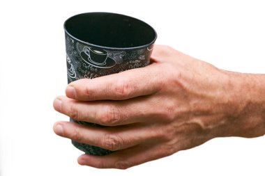 Coffee break. Men hand with a cup of coffee clipart