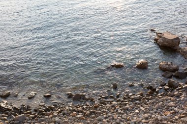 Small stones on the shore of the beach