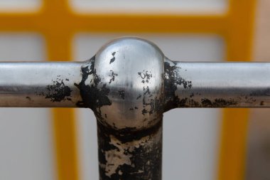 Close up image of a corroded metal handrail showing rust and damage clipart