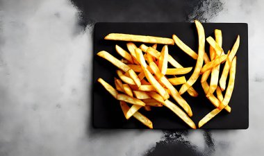 Lezzetli sıcak ve kızarmış patates. Fast food ve restoran ürünleri. Arkaplanda lezzetli patates kızartması var..