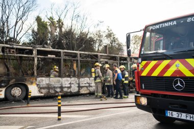 Portugal, Odivelas 07 September 2022 Rescue Team of Firefighters Arrive on the Car Crash fired passenger bus Traffic Accident Scene. Firemen fire department fight with fire on road. Accident disaster