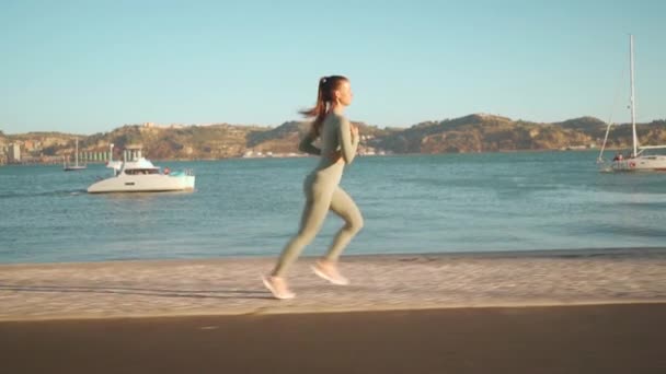 Confident Fit Female Jogging Embankment Area Coastal City Beautiful Sunny — Stok video