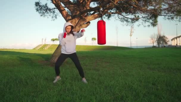 Woman Shadow Boxing Her Hands Wrapped Red Boxing Tapes Park — Vídeos de Stock