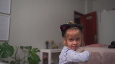 Crazy child dancing at home funny moving Going Mad and Emotional Little Girl. Young Funny Girl Yelling Screaming. Child Scream Loudly. Attention Deficit Hyperactivity Disorder.