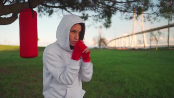 Woman Shadow Boxing Her Hands Wrapped Red Boxing Tapes Park — Stock video