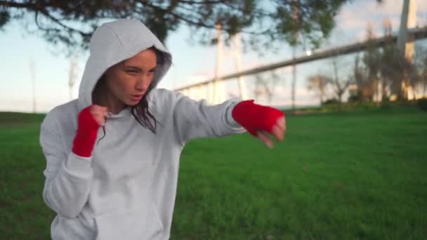 Woman Shadow Boxing Her Hands Wrapped Red Boxing Tapes Park — Video Stock
