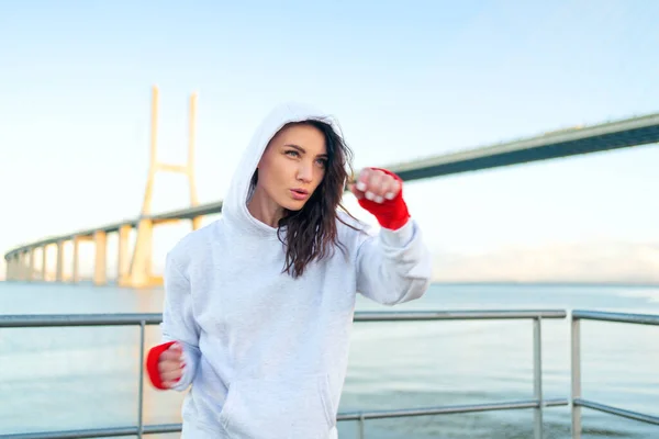 Woman Boxing Her Hands Wrapped Red Boxing Tapes Bridge Blue — Stock Photo, Image