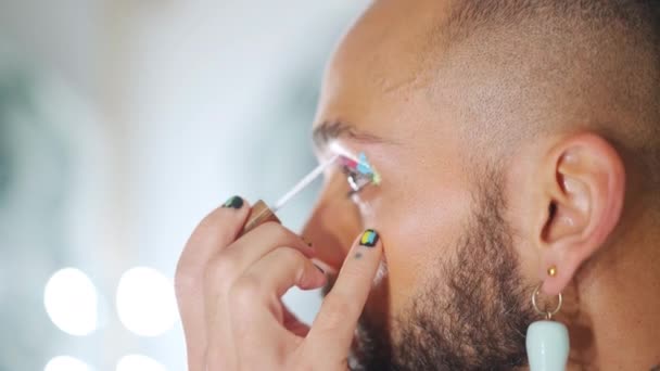 Young Black Transgender Man Applying Make Mascara Eyeshadows Lgbtq Man — Stok video