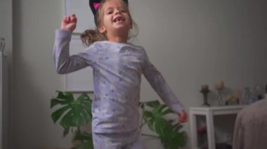 Crazy child dancing at home funny moving Going Mad and Emotional Little Girl. Young Funny Girl Yelling Screaming. Child Scream Loudly. Attention Deficit Hyperactivity Disorder.
