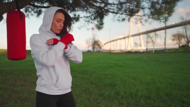 Woman Shadow Boxing Her Hands Wrapped Red Boxing Tapes Park — Vídeos de Stock