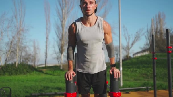 Muscular Man Doing Push Ups Exercises Parallel Bars Male Athlete — Αρχείο Βίντεο