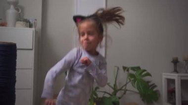 Crazy child dancing at home funny moving Going Mad and Emotional Little Girl. Young Funny Girl Yelling Screaming. Child Scream Loudly. Attention Deficit Hyperactivity Disorder.