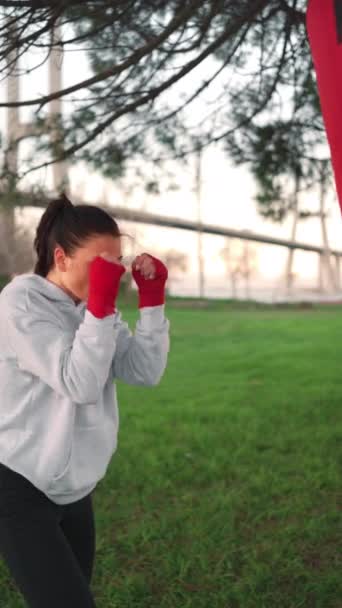 Woman Shadow Boxing Her Hands Wrapped Red Boxing Tapes Park — Vídeo de Stock
