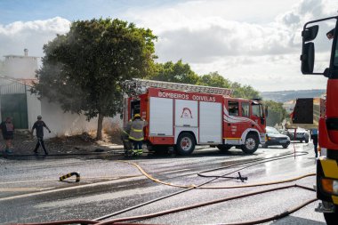 Portugal, Odivelas 07 September 2022 Rescue Team of Firefighters Arrive on the Car Crash fired passenger bus Traffic Accident Scene. Firemen fire department fight with fire on road. Accident disaster