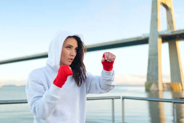 Woman Shadow Boxing Her Hands Wrapped Red Boxing Tapes Ocean — Foto de Stock