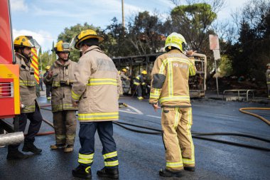 Portugal, Odivelas 07 September 2022 Rescue Team of Firefighters Arrive on the Car Crash fired passenger bus Traffic Accident Scene. Firemen fire department fight with fire on road. Accident disaster