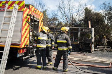 Portugal, Odivelas 07 September 2022 Rescue Team of Firefighters Arrive on the Car Crash fired passenger bus Traffic Accident Scene. Firemen fire department fight with fire on road. Accident disaster