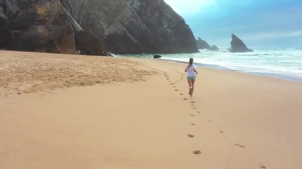 Drone Aerial Footage Slim Blonde Woman Running Ocean Beach Back — Stock Video