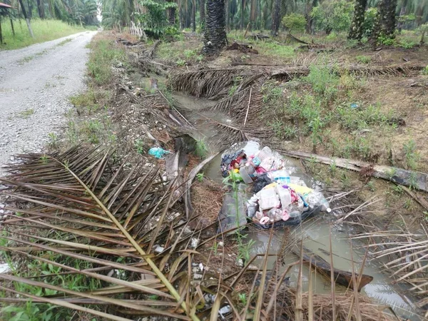 stock image Perak,Malaysia. October 31,2022: Scene of the irresponsible rubbish dumping of domestic waste along the isolated drain at Kg Koh Agriculture farm.