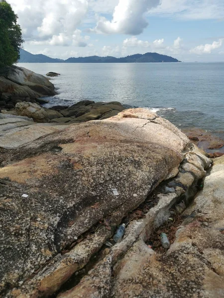 stock image lots of huge rocks found along the seaside