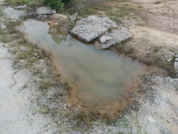 stock image the  big pothole on the isolated or vacant land.